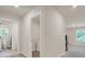 Bright hallway with tile bathroom access and laundry room at 4323 Cannon Walk, Ellenwood, GA 30294