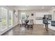 Bright open-plan kitchen with white cabinets, stainless appliances, granite counters and breakfast nook at 4323 Cannon Walk, Ellenwood, GA 30294