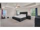Serene primary bedroom with a plush bed and lots of natural light at 4323 Cannon Walk, Ellenwood, GA 30294