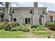 Exterior of home with sliding glass doors opening to a patio and lush landscaping, perfect for outdoor enjoyment at 52 Sutton Pl, Avondale Estates, GA 30002