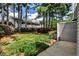 View of the backyard featuring a well-manicured lawn, mature trees, and a patio, ideal for relaxing outdoors at 52 Sutton Pl, Avondale Estates, GA 30002