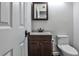 Clean and simple half bath with modern vanity and toilet at 52 Sutton Pl, Avondale Estates, GA 30002
