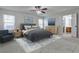 This bedroom features soft carpet, a ceiling fan, and an ensuite bathroom at 52 Sutton Pl, Avondale Estates, GA 30002