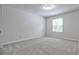 This bedroom features soft carpet and lots of natural light at 52 Sutton Pl, Avondale Estates, GA 30002