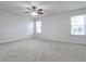 Spacious bedroom with neutral carpet, ceiling fan, and lots of natural light at 52 Sutton Pl, Avondale Estates, GA 30002