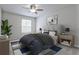 Comfortable bedroom with soft carpet, ceiling fan, and elegant decor at 52 Sutton Pl, Avondale Estates, GA 30002