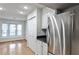 Eat-in kitchen area with stainless steel refrigerator and a bay window at 52 Sutton Pl, Avondale Estates, GA 30002