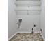 Utility room with tile floors, washer hookups, and wire shelving at 52 Sutton Pl, Avondale Estates, GA 30002