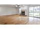 Bright living room with hardwood floors, fireplace, and sliding glass door at 52 Sutton Pl, Avondale Estates, GA 30002