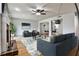 Bright living room with hardwood floors, ceiling fan, fireplace, and open floor plan at 52 Sutton Pl, Avondale Estates, GA 30002