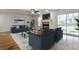 Inviting living room features a fireplace, hardwood floors, and sliding glass doors at 52 Sutton Pl, Avondale Estates, GA 30002