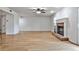 Spacious living room featuring hardwood floors and a classic brick fireplace at 52 Sutton Pl, Avondale Estates, GA 30002