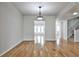 Open floor plan with gleaming hardwood floors and natural light at 52 Sutton Pl, Avondale Estates, GA 30002