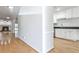 Bright living room with hardwood floors, fireplace, and open layout to the kitchen at 52 Sutton Pl, Avondale Estates, GA 30002