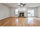 Bright living room with hardwood floors, fireplace, and sliding glass doors at 52 Sutton Pl, Avondale Estates, GA 30002