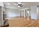 Spacious living room featuring hardwood floors, ceiling fan and open concept design at 52 Sutton Pl, Avondale Estates, GA 30002