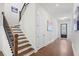 Hallway with hardwood floors and a staircase at 779 Keystone Dr, Woodstock, GA 30188