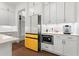 Modern kitchen boasts white cabinets and stainless steel appliances at 779 Keystone Dr, Woodstock, GA 30188
