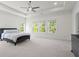 Spacious main bedroom suite with tray ceilings, carpet, and large windows with a view at 779 Keystone Dr, Woodstock, GA 30188