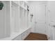 Well-organized mudroom features built-in shelving, cubbies, and drawers for storage and organization at 779 Keystone Dr, Woodstock, GA 30188