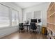 Bright office space with natural light, hardwood floors, built in shelves, and desks for two at 779 Keystone Dr, Woodstock, GA 30188
