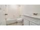 Cozy bathroom featuring a white tub and shower with tiled walls and vanity at 1150 Collier Nw Rd # A1, Atlanta, GA 30318