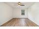 Bright, spacious bedroom with hardwood floors and a ceiling fan at 1150 Collier Nw Rd # A1, Atlanta, GA 30318