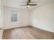 Bright bedroom featuring hardwood floors and a ceiling fan with light at 1150 Collier Nw Rd # A1, Atlanta, GA 30318