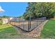 Community dog park enclosed by a chain link fence with green space at 1150 Collier Nw Rd # A1, Atlanta, GA 30318