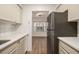Well-lit kitchen with white countertops, stainless steel appliances, and a view into the dining area at 1150 Collier Nw Rd # A1, Atlanta, GA 30318