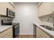 Functional kitchen design showcasing stainless steel appliances and sleek countertops for modern cooking at 1150 Collier Nw Rd # A1, Atlanta, GA 30318
