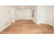 Bright living room featuring sleek hardwood floors, white walls, and natural light from a window at 1150 Collier Nw Rd # A1, Atlanta, GA 30318