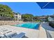 Sparkling community pool with lounge chairs and lush landscaping at 1150 Collier Nw Rd # A1, Atlanta, GA 30318