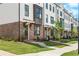 Inviting townhome exterior with brick facade and covered entryway at 5440 Howington Ct # 190, Buford, GA 30518