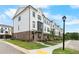 Charming townhome showcases white painted brick and black framed windows at 5440 Howington Ct # 190, Buford, GA 30518