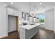 Modern kitchen featuring an island with quartz countertop, subway tile backsplash, and stainless steel appliances at 5440 Howington Ct # 190, Buford, GA 30518