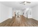 Open-concept living room featuring hardwood floors, white walls, and recessed lighting at 5440 Howington Ct # 190, Buford, GA 30518