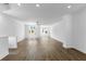 Spacious living room with hardwood floors, recessed lighting, and large windows offering natural light at 5440 Howington Ct # 190, Buford, GA 30518
