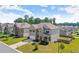 Aerial view of a beautiful brick two-story home in a well-maintained neighborhood at 7410 Ansley View Ln, Cumming, GA 30028