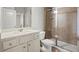 Neutral bathroom featuring a tile shower, glass door, and traditional vanity at 7410 Ansley View Ln, Cumming, GA 30028