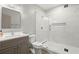 Bathroom features a marble-walled shower with glass door at 7410 Ansley View Ln, Cumming, GA 30028