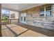 Covered wooden deck with view of the backyard and brick exterior at 7410 Ansley View Ln, Cumming, GA 30028