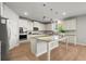 Modern kitchen with stainless steel appliances, granite countertops, and a large island perfect for entertaining at 7410 Ansley View Ln, Cumming, GA 30028