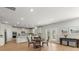Open kitchen featuring a breakfast bar, stainless steel appliances, and modern lighting at 7410 Ansley View Ln, Cumming, GA 30028