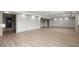 Spacious living room boasts hardwood floors and recessed lighting at 7410 Ansley View Ln, Cumming, GA 30028