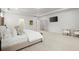 Large main bedroom boasting a TV, seating area, and light-colored walls at 7410 Ansley View Ln, Cumming, GA 30028