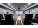 Home theater with projector and theater seating at 7410 Ansley View Ln, Cumming, GA 30028