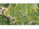 Aerial view of a wooded lot with mature trees and surrounding homes in a neighborhood at 80 Cliffcreek Trce, Atlanta, GA 30350