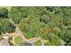 Aerial view of a wooded lot, outlined in red, with mature trees in a desirable neighborhood at 80 Cliffcreek Trce, Atlanta, GA 30350