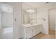 Bright bathroom with a white vanity and a large mirror at 80 Cliffcreek Trce, Atlanta, GA 30350